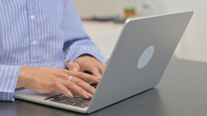 Close up of Female Hands Typing on Laptop