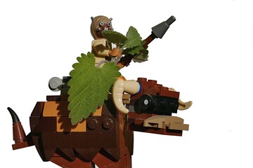Fototapeta premium LEGO Star Wars Tusken raider figure from Tatooine carrying Catnip plant (Nepeta Cataria) leaves, while riding on Banthas bull mount