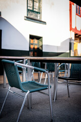 Bar terrace in Lastres, Asturias, quiet evening, showcasing local gastronomy and culture.