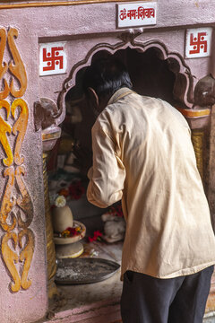 Man praying in a Hindu temple in Babra village, Maharashtra, India