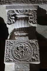 Ajanta caves, a UNESCO World Heritage Site in Maharashtra, India. Column with reliefs in cave...