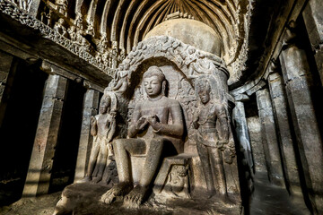 Ellora caves, a UNESCO World Heritage Site in Maharashtra, India. Cave 10.  Teaching Buddha, seated in the bhadrasana pose on a lion throne. 