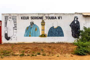 Wall with pictures of mouride muslim spiritual leaders in Tawafall, Senegal