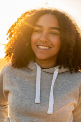 Mixed Race Biracial African American Girl Teenager Smiling at Sunset - 777422487