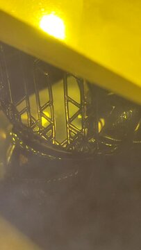 3D printer working process. 3D printing. Stereolithography photopolymerization SLA. Additive manufacturing technology. Liquid materials, hard part, creating layers. Ultraviolet polymerization Vertical