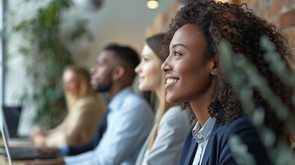 A group of diverse colleagues engaged in a productive team meeting, showcasing teamwork in a modern office setting.
