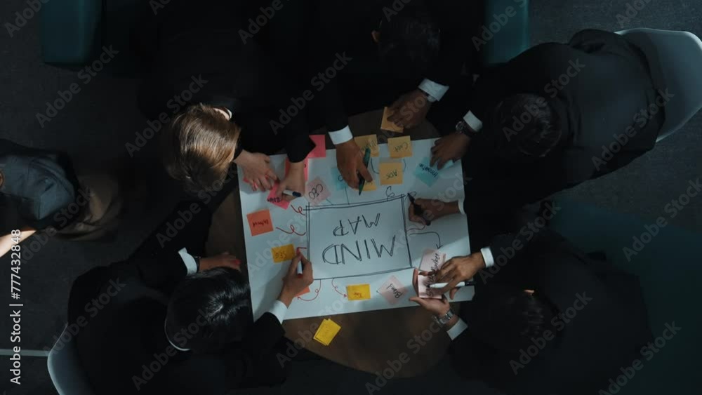Aufkleber top down aerial view of group of smart diverse business people brainstorm marketing idea while writi