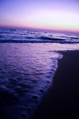 Sunset on the beach in the evening. Beautiful sunset over the sea.