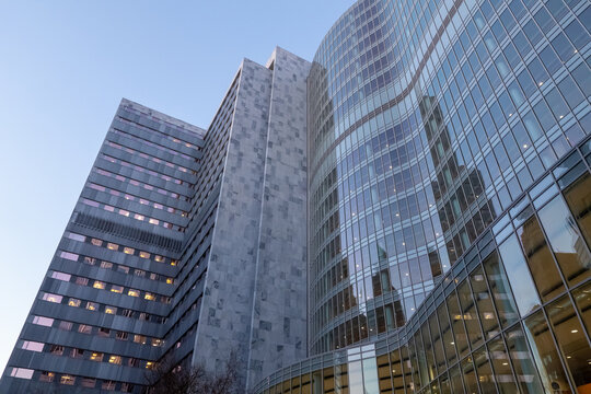 ROCHESTER, MN &ndash; 14 DEC 2023: The Mayo Building and Gonda Building in early morning light as other buildings are reflected in the glass windows.