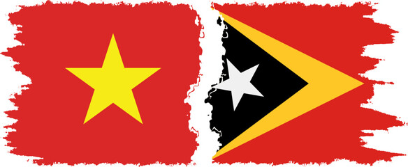 Timor-Leste - East Timor and Vietnam grunge flags connection vector