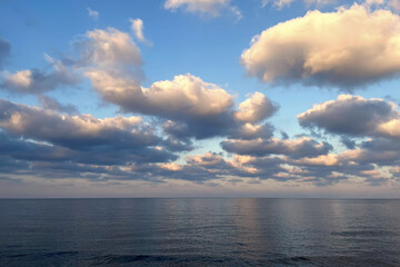 Beautiful blue sea and sky with clouds. Nature background.