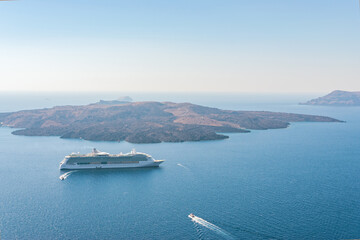 Cruise ship and boats close to the Santorini island. Greece.