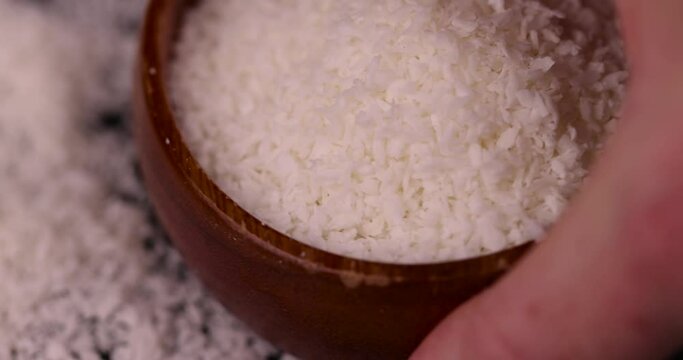 dry white coconut chips for adding to desserts, finely chopped coconut pulp dried in sugar syrup