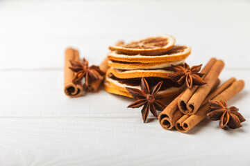 Ceylon cinnamon sticks and anise on a textured wooden background.Cinnamon roll and star anise. Spicy spice for baking, desserts and drinks. Fragrant ground cinnamon.Place for text. copy space.