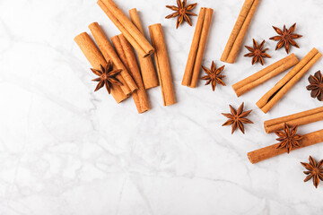 Ceylon cinnamon sticks and anise on a textured wooden background.Cinnamon roll and star anise. Spicy spice for baking, desserts and drinks. Fragrant ground cinnamon.Place for text. copy space.