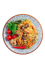 Pilaf with mutton, a dish of stewed meat with rice, carrots, onions and garlic. Oriental cuisine with spices and rice, top view