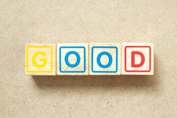Wooden alphabet letter block in word good on wood background