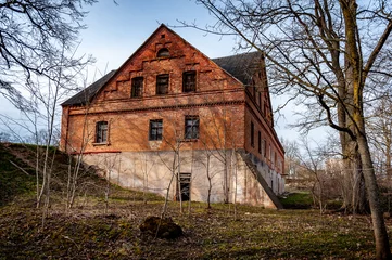 Poster de jardin  Old brick water mill building. Berkenes, Latvia.  © Regina