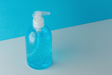 Hand sanitizer in a bottle on a bright background. Coronavirus prevention concept.
