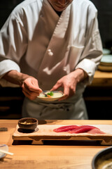 Obraz na płótnie Canvas Harmony of taste and physical presentation of the dish, the chef prepares for serving sushi or sashimi, a combination of Japanese cuisine and the new wave of molecular gastronomy
