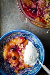 Blueberry and peach crisp with vanilla ice cream