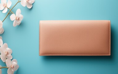 Elegant leather wallet on a blue background with flowers