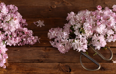 natural fresh bouquet of lilacs on wooden background