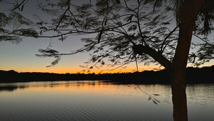 Golden sunset at Laguna Petenchel in Peten, Guatemala