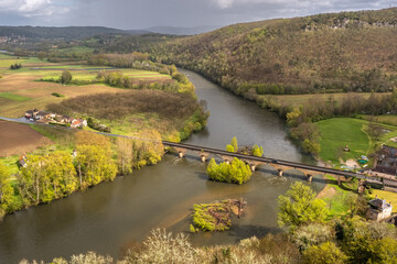 Pont de Castelnaud bridge crossing the Dordogne river in springtime in France