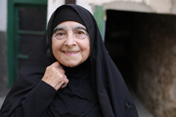 Elder muslim woman with creative make up 
