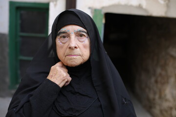 Senior Islamic woman close up