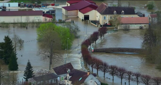 Natural disaster in Burgundy, France. Water flooded a city in the Yonne department. Aerial view of the floods in the center of France. Yonne river in flood in Chablis town. Spring flood 2024