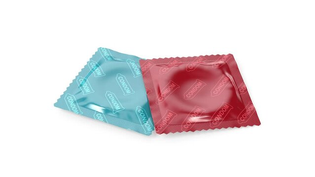 Two different condoms on white background
