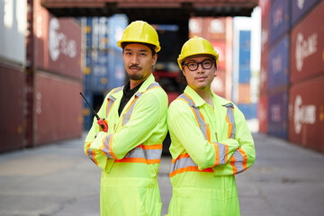 workers or engineers smiling and folded arms pose in containers warehouse storage