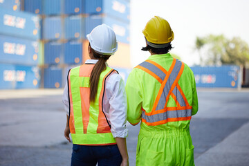 back view workers working and looking at containers warehouse storage