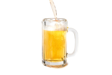 Beer pouring into a full glass stein with a nice head isolated on white