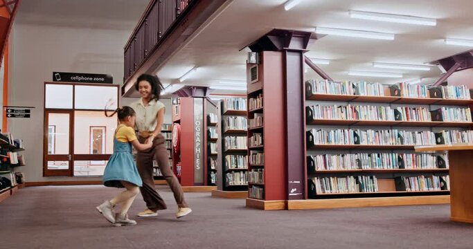School, tutor or girl in a library dancing with smile for knowledge or development for future learning. Lady teacher, education or happy child student playing with parent, mother or woman on a break
