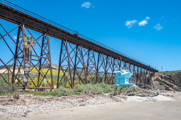 old railway bridge and beach with lifeguard tower at Gaviota at cabrillo Highway, California Highway no 1