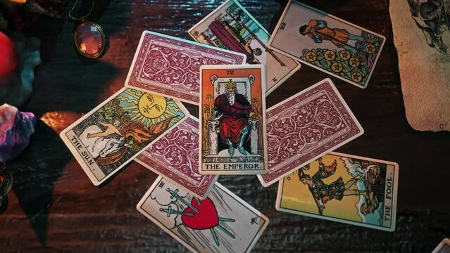 Belgrade, Serbia - September 2, 2015. Performing wizardry focus during the ritual by reading the regal emperor card. Ritual focus predicts future regal authority. Ritual focus describes regal destiny.