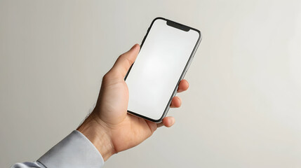 Mock-up phone in hand on a gray background close-up copy space