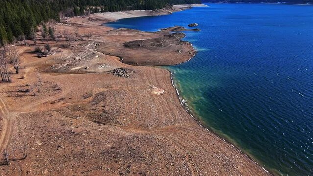 Scenic forward shot from above Lake Cle Elum shore with calm waters in Washington State
