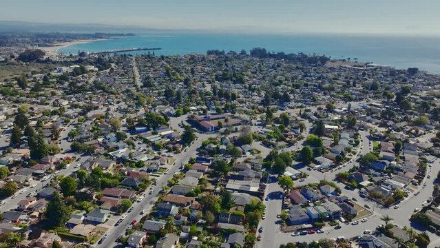 Aerial footage of Westside Santa Cruz's 'Circles' neighborhood on a sunny day, backdrop of Monterey Bay.