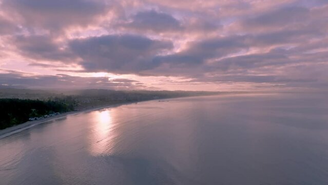 Breathtaking aerial footage captures Capitola cliffs overlooking the serene, glassy ocean of New Brighton Beach, California