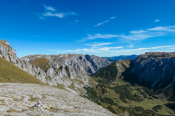 Panoramic view of majestic mountain peak Ringkamp in untamed Hochschwab mountain region, Styria, Austria. Scenic hiking trail on blue sky sunny day in remote Austrian Alps. Wanderlust in alpine spring
