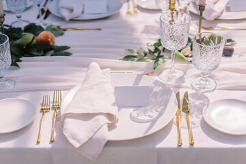 Sophisticated table setting with gold cutlery