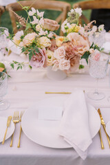 Elegant wedding place setting with gold accents