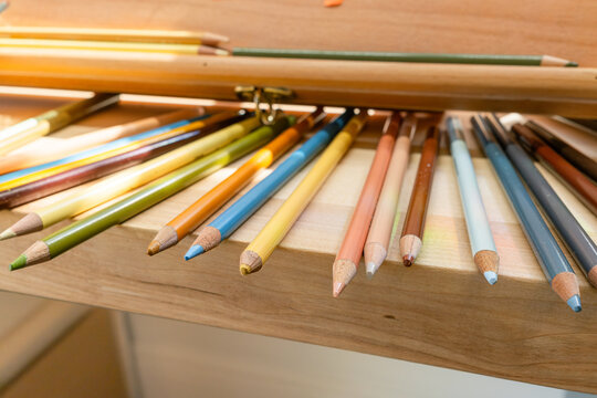 Colored Pencils on Woden Desk - Colors - Horizontal Close Up