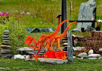 Elecmonar. Russia. May 11, 2023. Unusual sculptures of prehistoric animals from set plates in the Gorny Altai Paleopark.