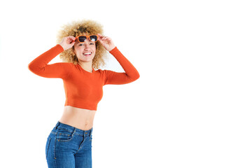 young brazilian girl with blonde afro hair smiling with orange sunglasses on white background