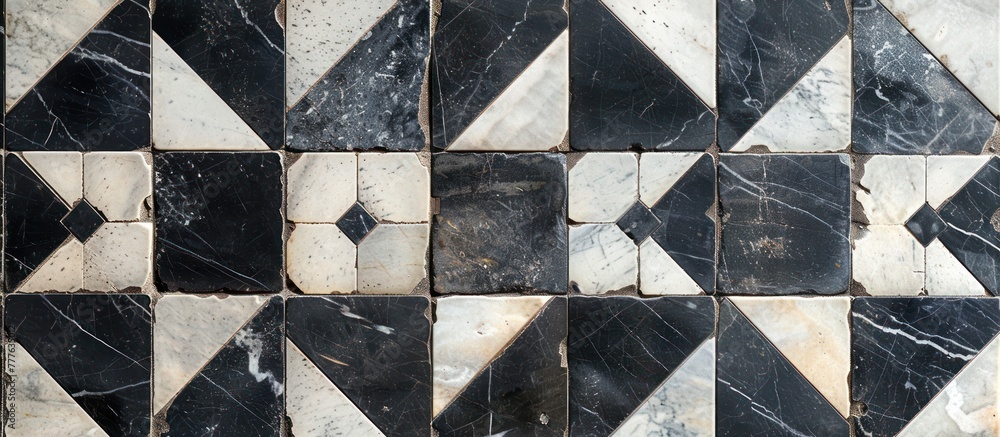 Poster a black and white marble tile with a diamond pattern design, creating a striking visual effect.